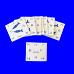 Small 12-page paper booklet (zine) with a print of two fish, Pisces on display, 4.25 inch by 3.66 inch dimension. 