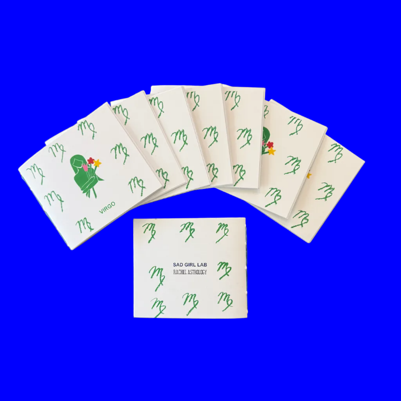 Small 12-page paper booklet (zine) with a print of a woman holding flowers, Virgo on display, 4.25 inch by 3.66 inch dimension. 